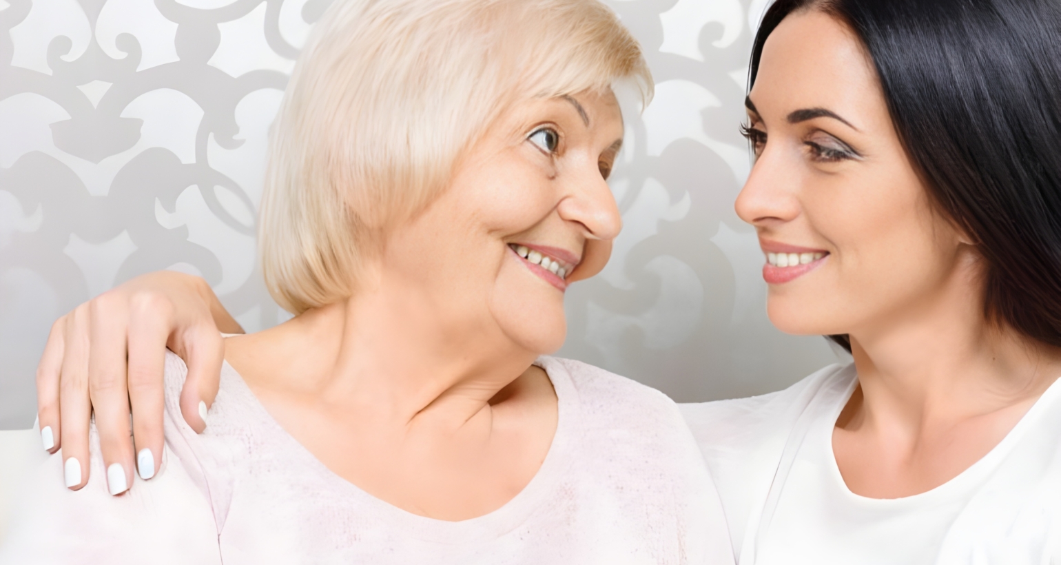 Lady speaking with elderly women.